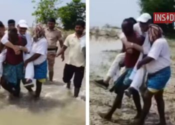Tariq Anwar sitting on youth’s shoulder in flood area Congress MP Tariq Anwar Bihar flood visit कटिहार बाढ़ प्रभावित क्षेत्र का दौरा Tariq Anwar viral video from Katihar Bihar Ganga erosion site inspection