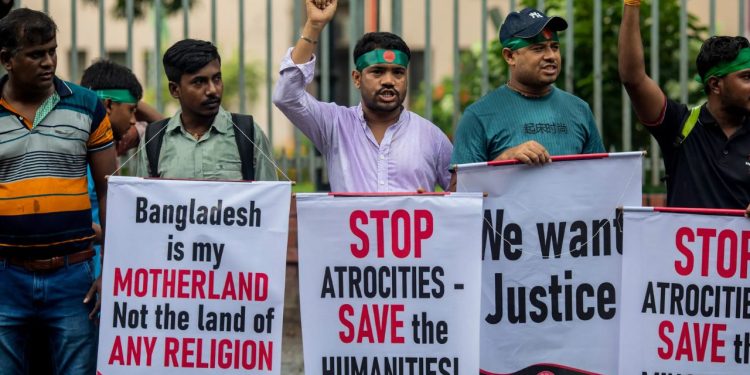 Bangladesh Hindu violence protest image, India Bangladesh diplomatic tension, Mohammad Yunus government Bangladesh, Hindu minority attack Bangladesh