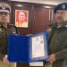 IG Kiran S receiving Interpol Medal of Excellence certificate, UP Police international award ceremony, Rajeev Krishna DGP handing certificate to Kiran S, Interpol General Assembly Morocco session image